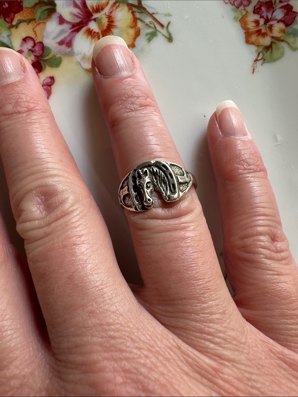 Lucky horseshoe with boots ring. Marked Sterling